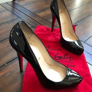 Louboutin platform black patent heels.